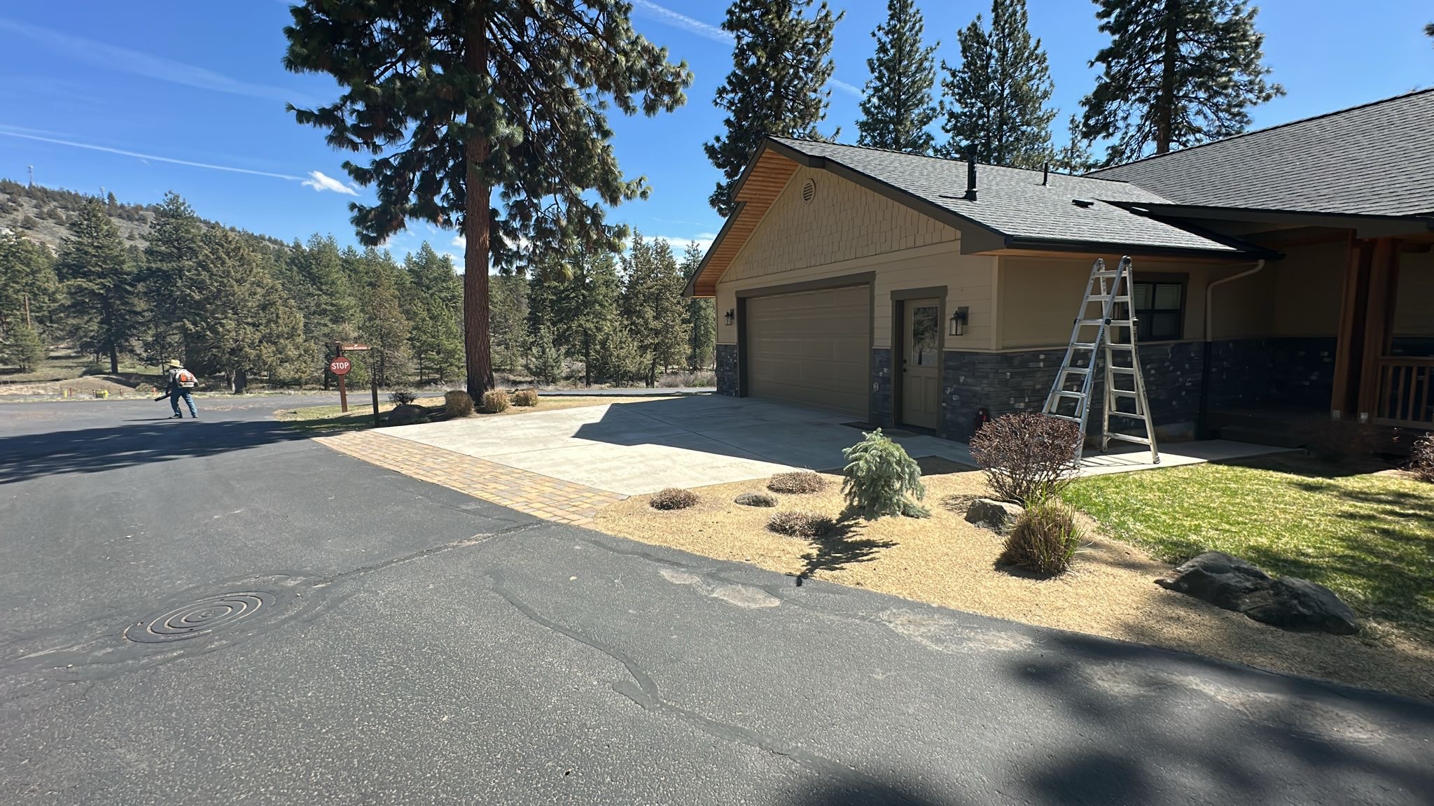 New paver driveway and walkway installed at a home under construction